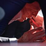 Trump moments after being struck by an assassin's bullet.